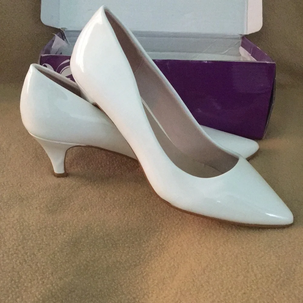 White patent pumps